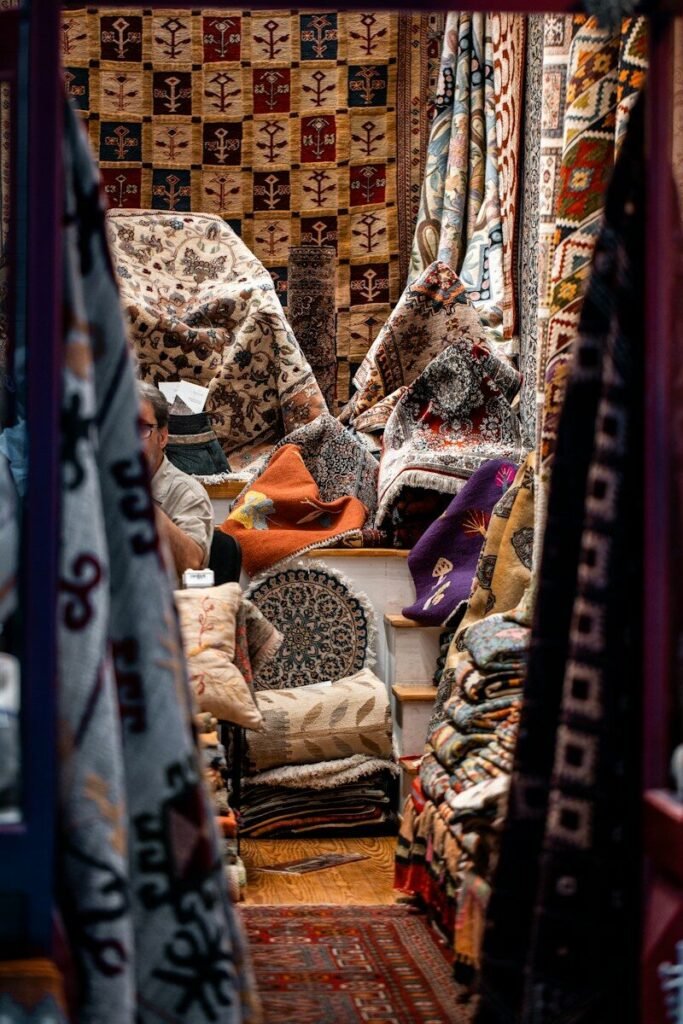 Athens market stall with colorful rugs and textiles